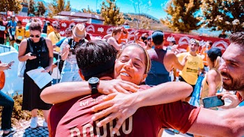 Woman Hugging Man at Middle of Field