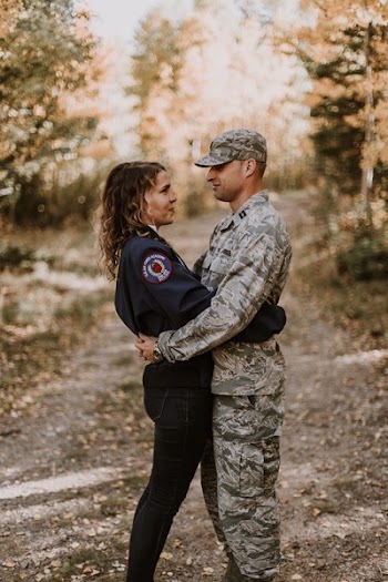 Woman Hugging Man In Service Uniform