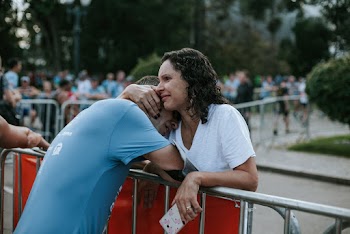 Woman Hugging Man Wearing Blue Crew Neck Shirt