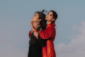 Woman Hugging Woman on Her Back