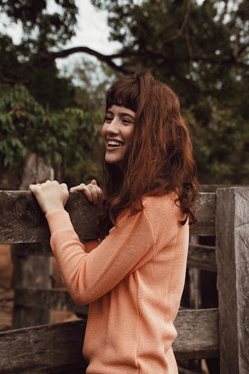 Woman Hugging Wood Fence
