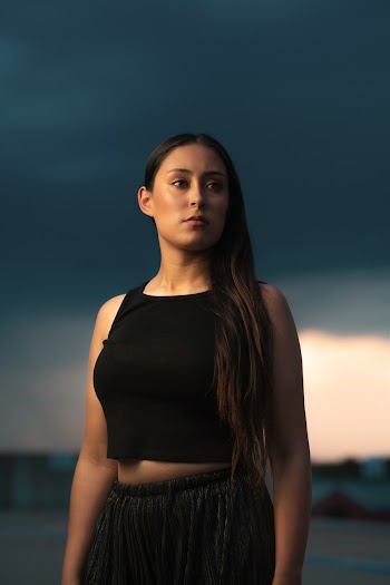 Woman In A Black Tank Top