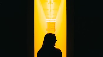 Woman In A Hallway