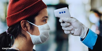 Woman in a medical mask getting her temperature measured by an electro.. | Free  photo - 2296516