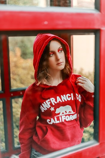 Woman in a Red Hooded Pull-up Sweater