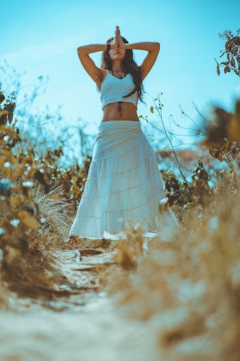 Woman in a White Top and Skirt