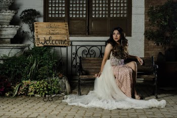 Woman in Beige Dress Sitting on Bench