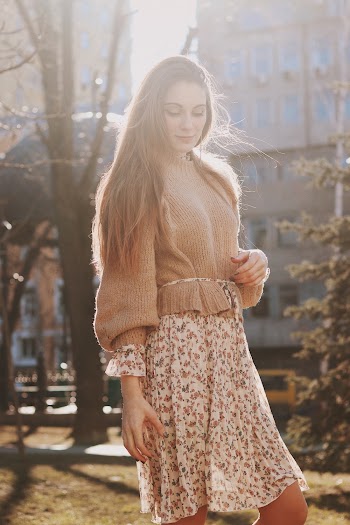 Woman in Beige Knit Sweater and White Floral Skirt in Park
