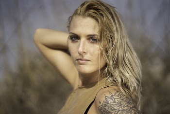 Woman in Beige Sleeveless Shirt