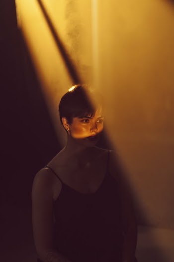 Woman In Between Sun Rays  · Free Stock Photo