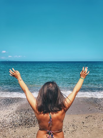 Woman In Bikini Facing Sea