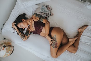 Woman in Bikini Sleeping on Bed