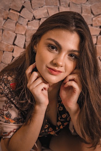 Woman in Black and Brown Floral Shirt