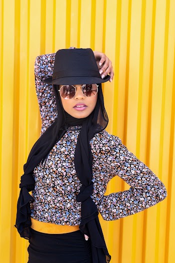 Woman in Black and Multicolored Floral Long-sleeved Shirt
