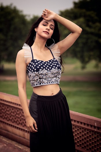 Woman in Black and Silver Bralet
