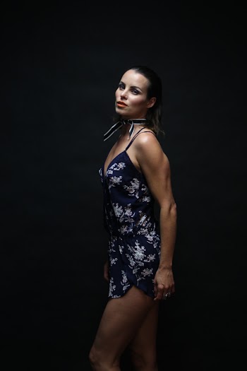 Woman In Black and White Floral Spaghetti-strap Mini Dress