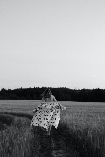 Woman in Black and White Hijab Standing on Green Grass Field · Free Stock Photo