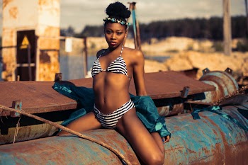 Woman in Black and White Striped Bikini Posing for a Photo