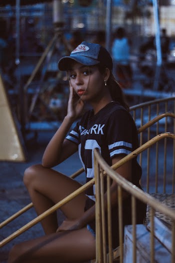 Woman in Black and White T-shirt and Von Dutch Cap
