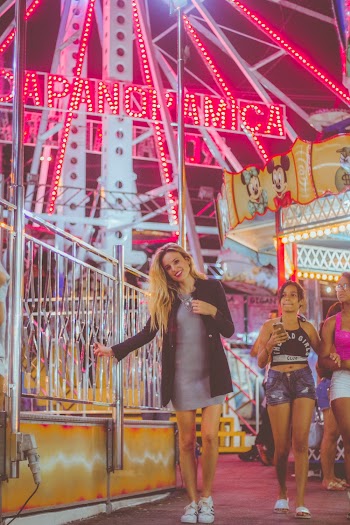 Woman In Black Blazer Standing Near Ferris Wheel