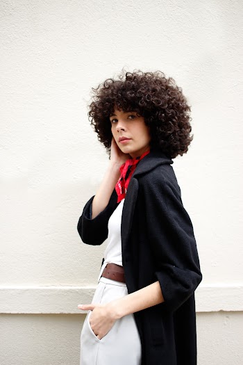 Woman in Black Cardigan and White Top Standing