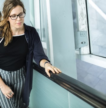 Woman in Black Cardigan Wearing Eyeglasses