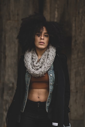 Woman in Black Coat and Black Bottoms