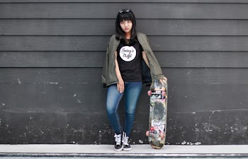 Woman in Black Crew-neck Shirt and Blue Jeans