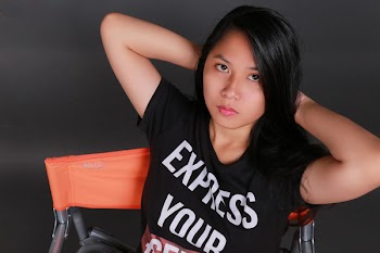 Woman in Black Crew-neck Top Sitting on Orange and Gray Chair
