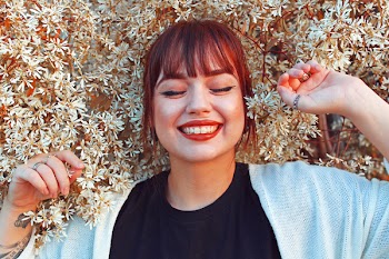 Woman in Black Crew-neck Top Wearing White Cardigan