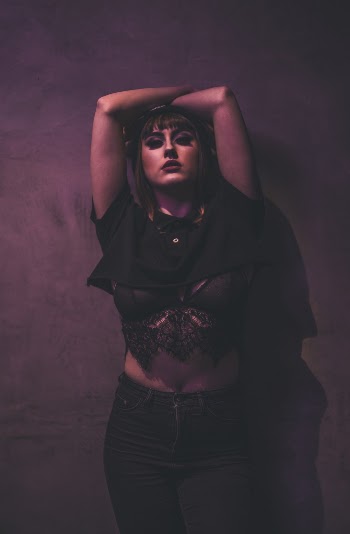 Woman in Black Crop Top and Black Denim Jeans