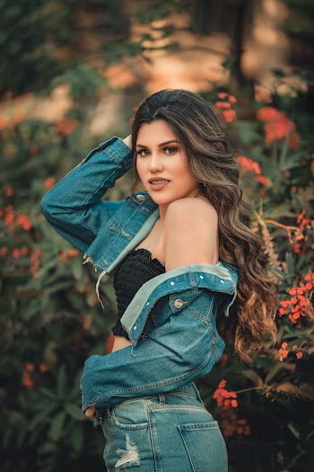 Woman In Black Crop Top And Blue Denim Jacket 