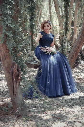 Woman in Black Floral Gown Sitting