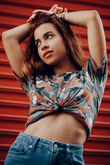Woman in Black, Gray, and Red Camouflage Crop Top T-shirt