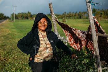 Woman in Black Hoodie on Green Field