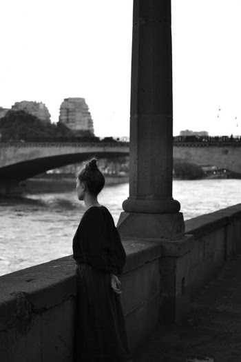 Woman in Black Jacket Standing Near Body of Water · Free Stock Photo