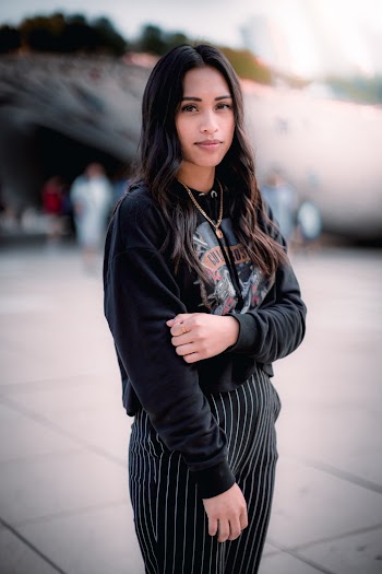 Woman in Black Jacket Standing on Road