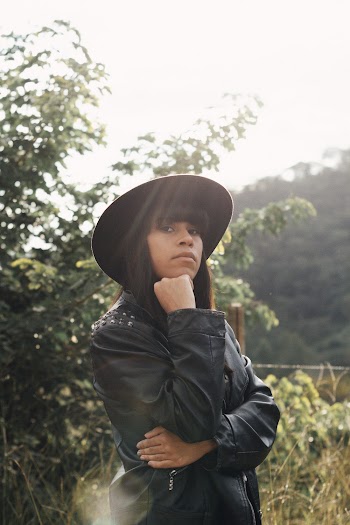 Woman in Black Leather Coat