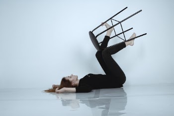 Woman in Black Leggings Lying on Floor