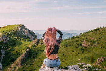 Woman in Black Long-sleeved Crop Top Sitting over Looking Mountain