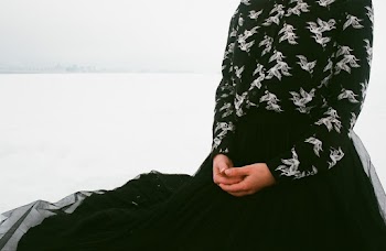 Woman in Black Long Sleeved Dress