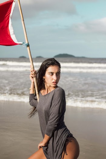 Woman in Black Long-sleeved Shirt Holding Bamboo Stick