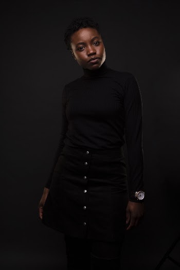 Woman in Black Long-sleeved Top and Black Skirt