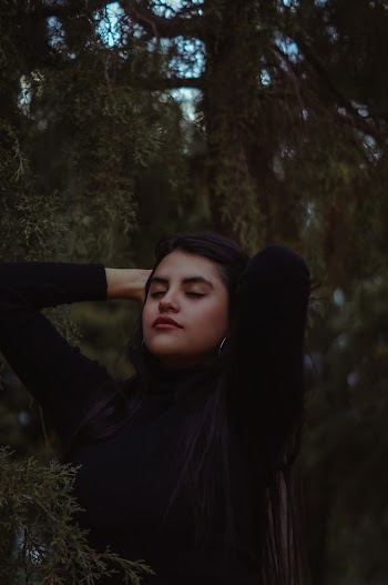 Woman in Black Long-sleeved Top Near Tree