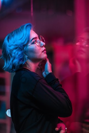 Woman In Black Long-sleeved Top Wearing Eyeglasses