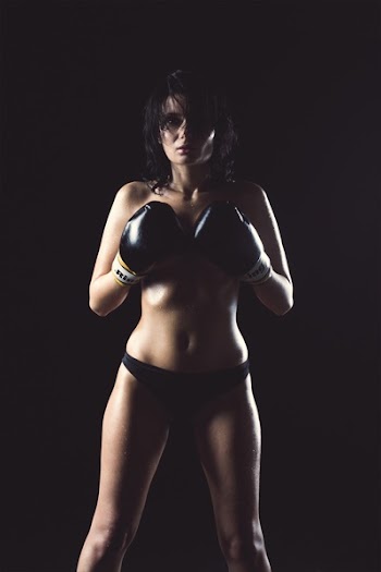 Woman in Black Panty Wearing Black Boxing Gloves Posing for Picture