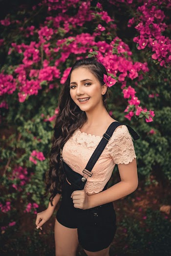 Woman in Black Rompers With Suspenders