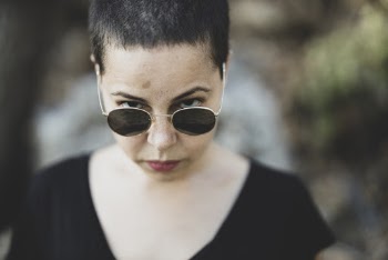 Woman In  Black Scoop-neck Shirt With Sunglasses