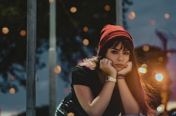 Woman In Black Shirt Wearing Red Knit Cap