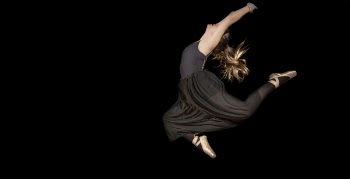 Woman in Black Sleeveless Shirt and Pants Jumping